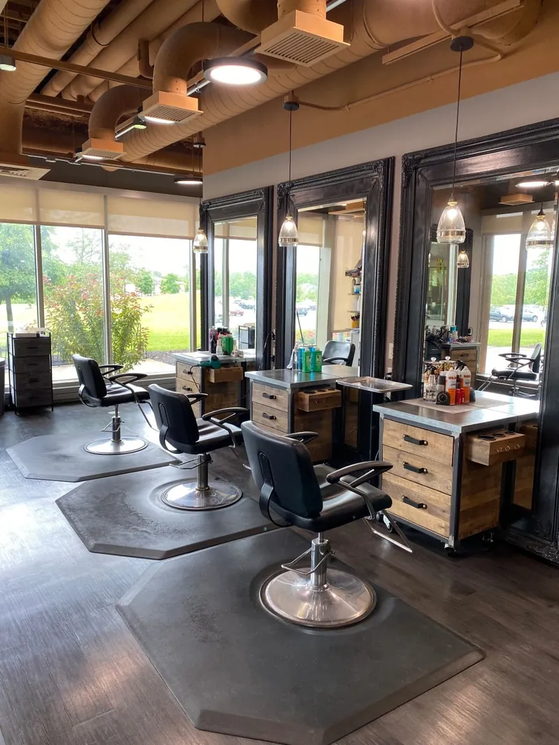 Shear Global Salon's styling floor with chairs and mirrors